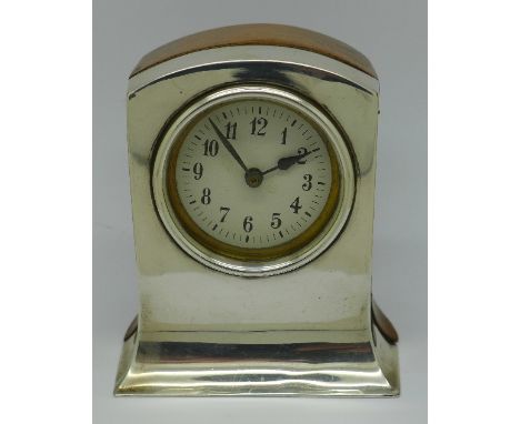 A silver fronted and oak table clock