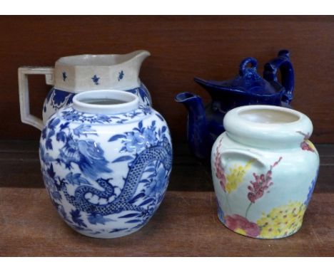 An E. Radford Burslem jar, a 19th Century teapot, a Royal Doulton jug and Chinese ginger jar, lacking lid (4)