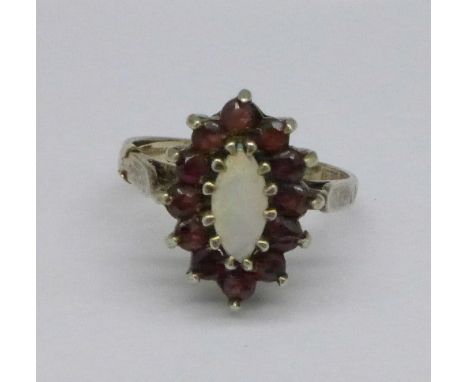 A silver, garnet and opal ring, N