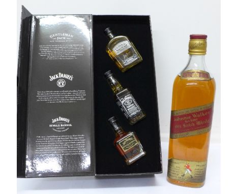 A bottle of Johnnie Walker Red Label Old Scotch Whisky and three small bottles of Jack Daniels in presentation box
