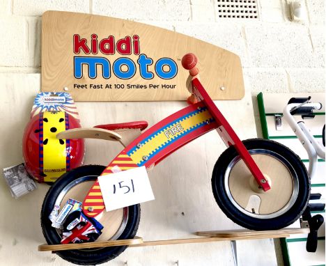 A KiddiMoto children's wooden balance bike, red 'Fire' engine colours, red seat, together with a matching KiddiMoto helmet an