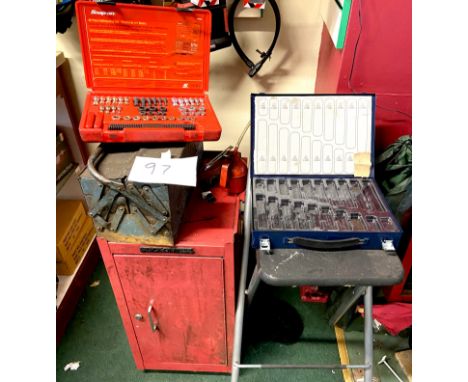 A group of tools, including a red Stack-On cabinet, a red Snap-On 48 piece Rethreading Set - Fractional and Metric, blue meta