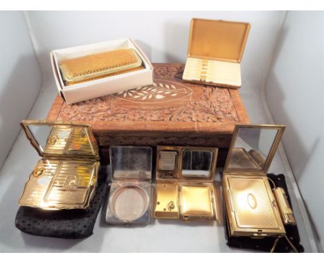 A wooden inlay box, containing a Lady's chain purse, a Kigu powder lipstick and cigarette compact with material dust cover, a