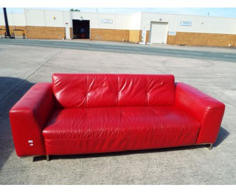 A good quality red leather sofa.