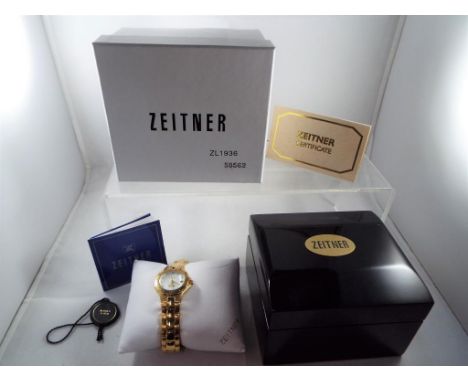 A ZEITNER Aqua Sports watch set with diamonds and Mother of Pearl face, with a manual and certificate of authenticity, origin