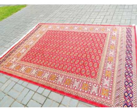 A Bokhara carpet with a red ground, approx 280cm x 200cm Est £100 - £120