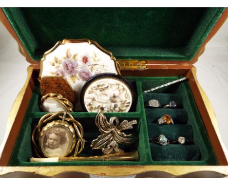 An Art Nouveau style jewellery box, containing costume jewellery to include four silver rings, a vintage pocket hand mirror b