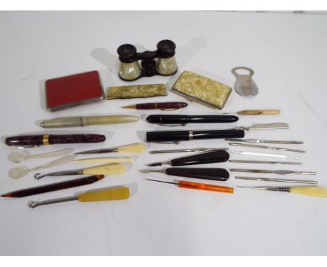 A mixed lot to include a small quantity of pens comprising a Conway Stewart, an Osmiroid, opera glasses, cigarette case and c