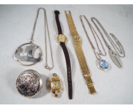 Silver - a silver necklace and pendant in a for of a Viking shape, a silver necklace and pendant set displaying a cross in an