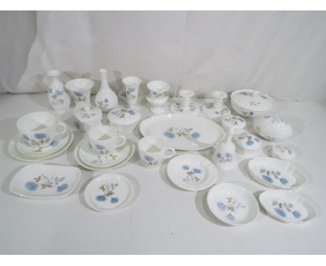 Wedgwood - a collection of 36 items of Wedgwood in the Ice Rose pattern to include candle stick, cups, saucers, trinket boxes