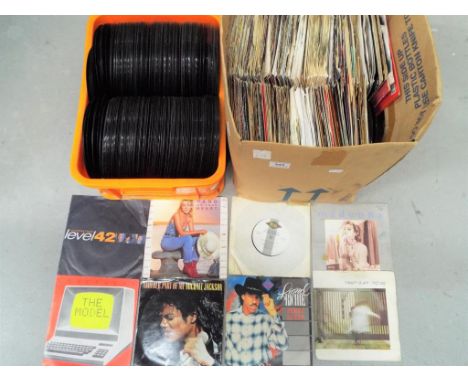 A lot to include two boxes of 45 rpm vinyl records predominantly pop to include Kylie Minogue, Level 42, Michael Jackson, Kra