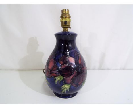 Moorcroft Pottery - a Moorcroft Pottery lamp base decorated with anemone on a blue ground, approx 26cm (h) to top of attachme