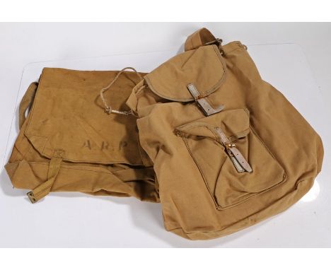 Second World War haversack stamped to the A.R.P., together with a Buktar rucksack dated 1943 and stamped with a broad arrow, 