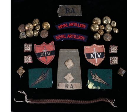 Grouping of badges and buttons to a Royal Artillery officer,to include an olive green slip on shoulder title to a Royal Artil