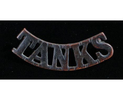 First World War Tank Corps shoulder title, two loops to the reverse, the 'TANKS' shoulder title was worn unofficially between