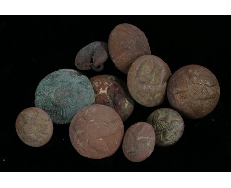 American Civil War tunic buttons including a North Carolina 'Sunburst' coat button, ground dug, shank missing, 23 mm diameter