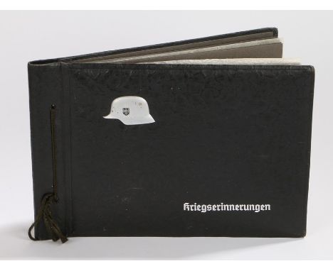 Second World War German soldiers photograph album, the cover has a representation of a German steel helmet with Werhmacht dec