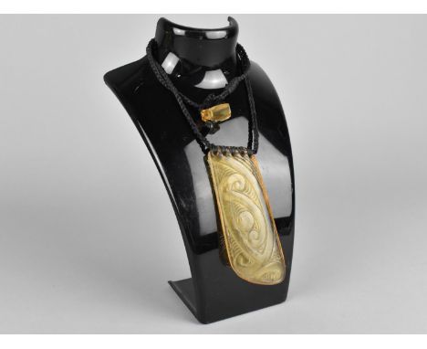 A Cast Resin Tribal Amulet on Braided Leather Cord 