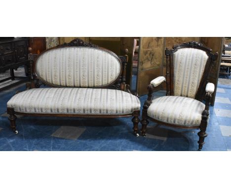 A 19th Century Victorian Walnut Upholstered Sofa with Carved Frame together with a Similar Victorian Open Armchair 