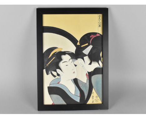 A Framed Japanese Woodblock Print Kitagawa Otamaro (1753-1806) Depicting Naniwa Okita Admiring Herself, 24.5x37cms 