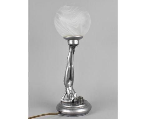 A Resin Art Deco Style Lamp Base in the Form of a Nude Supporting Opaque Globe Shade with Feet, 45cms Wide 