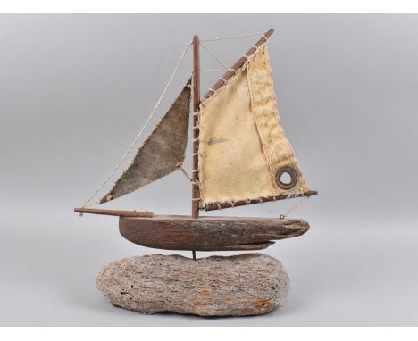 A Wooden Model of a Boat on Driftwood Base, 36cms High 