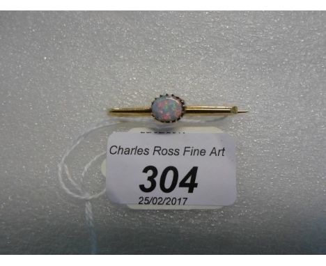 A single stone opal bar brooch, the claw mounted oval opal horizontally set to plain gold bar.