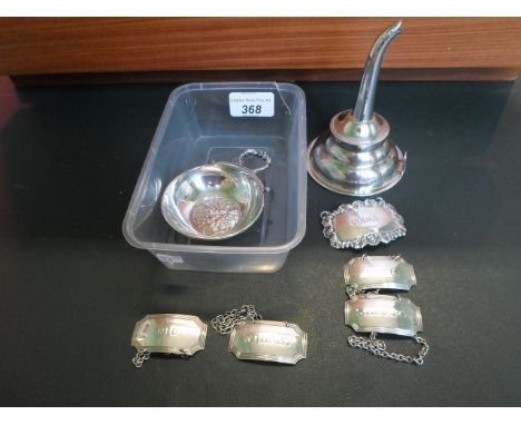 A silver wine funnel, London hallmarks 1977, together with five silver decanter labels and a silver quaich, various dates and