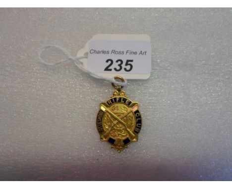 A 9 carat gold and enamel medallion for the Cottesmore Rifle Club, commemorative inscription to the reverse, Birmingham 1908,