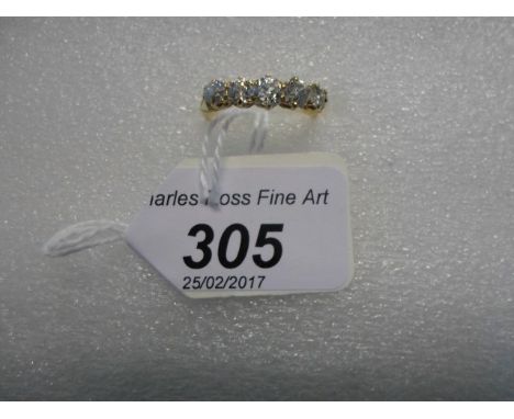 A five stone half hoop diamond ring, the graduated brilliant cut diamonds in pierced and engraved claw mounts.   Condition Re