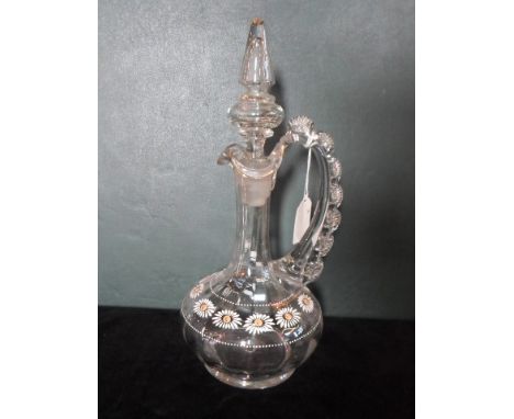 A Victorian painted glass decanter and stopper, having a frilled loop handle, daisy decoration with gilt finish, (31cm).