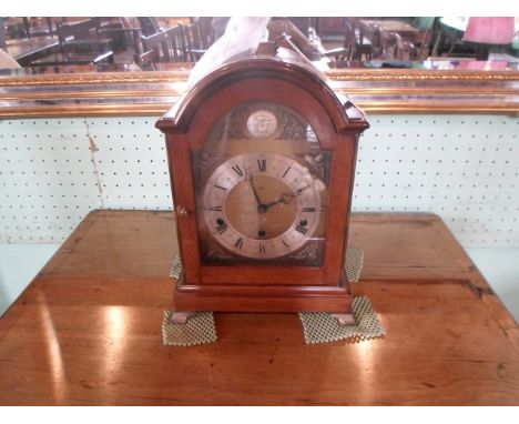 A 20th century mahogany cased domed top mantle clock, eight day lever Westminster and Whittington chiming movement, the brass