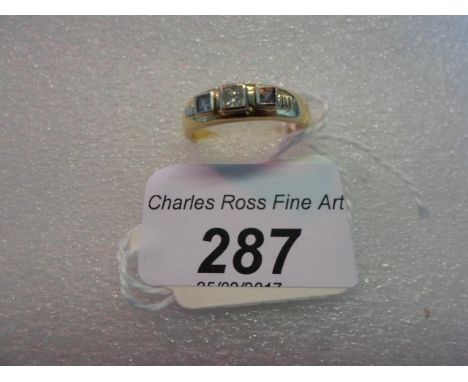 A sapphire and diamond three stone half hoop ring, the square cut sapphires and princess cut diamond in raised rub-over mount