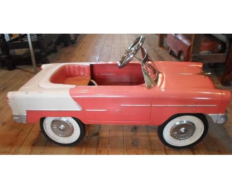 A late 20th century child's pedal car, modelled as a 1950's Chevrolet, having chrome mounted windscreen and steering wheel, (