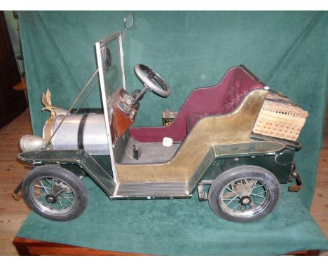 A 1960's scratch built model of a Vintage car, fitted with electric motor for forward and reverse motion, complete with inbui