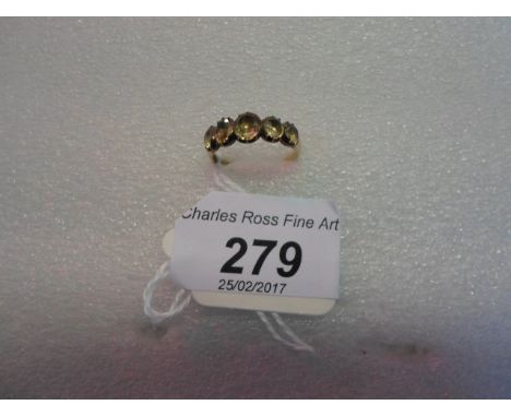 An early 19th century five stone half hoop graduated citrine ring, the oval cut stones enclosed back claw mounts.   Condition