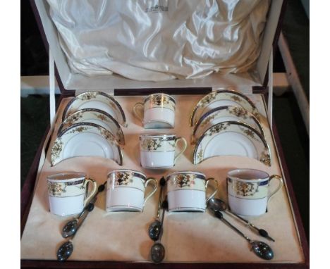 A mid-20th century cased Noritake porcelain coffee set, comprising: six cans and saucers, together with six silver plated cof