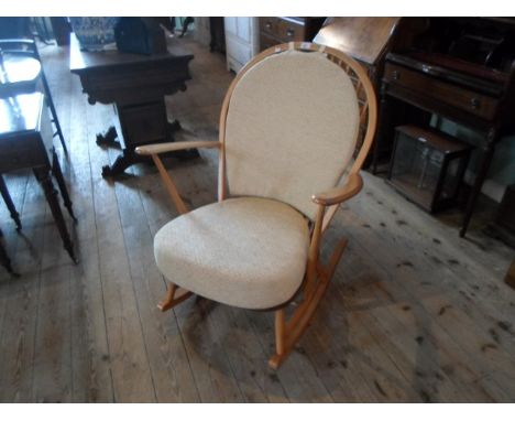 A late 20th century Ercol-style stick back rocking chair, (75cm wide).