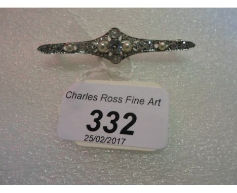 A Belle Epoque diamond and pearl bar brooch, the principal old brilliant cut diamond set between two cultured pearls with old
