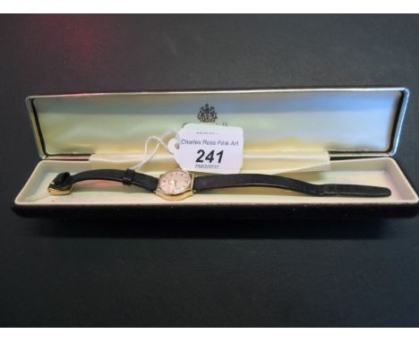 A lady's 9 carat gold wristwatch, the circular champagne dial with Arabic and button numerals, signed Vertex.