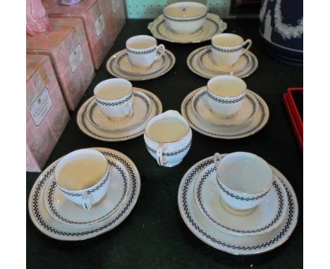 A mid-20th century Taylor & Kent Staffordshire part-tea service, a six place setting, comprising: trios, open sugar bowl, mil