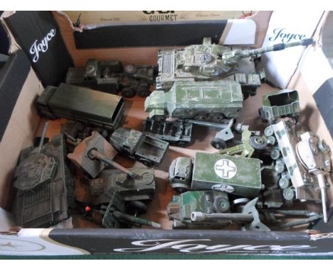 A quantity of Dinky military vehicles to include: a 651 Centurion Tank, a 660 Tank Transporter, a 688 Field Artillery Tractor