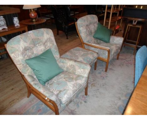 A pair of Parker Knoll light oak upholstered armchairs, together with conforming footstool.