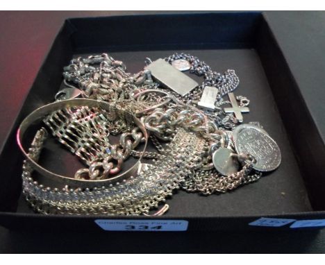 A mixed lot of silver, to include: an ingot and chain, bangle, bracelet and other items of white metal.