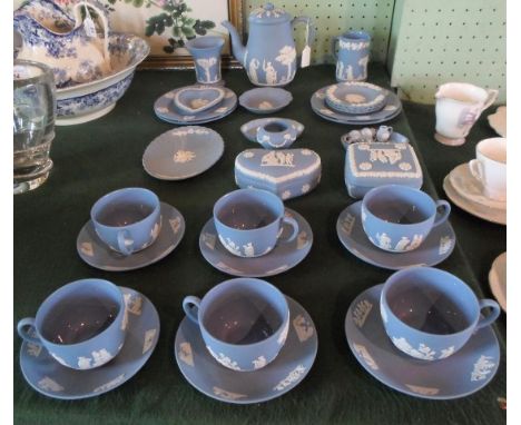 A good quantity of twentieth century Wedgwood Blue Jasperware, to include: a teapot, cups & saucers, covered dishes, miniatur