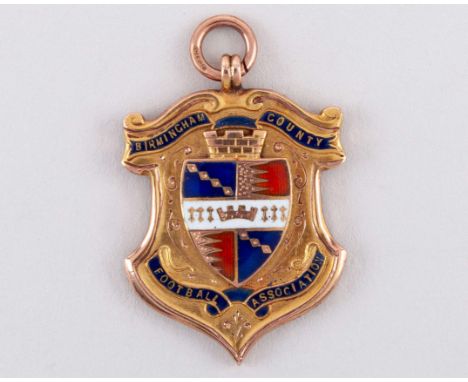 9ct gold and enamel football medal 1909-10, the obverse inscribed BIRMINGHAM COUNTY FOOTBALL ASSOCIATION, the reverse inscrib