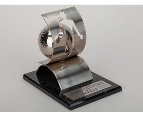 Pelé Ecumenical Fraternity Order of Merit trophy, a silver tone metal "Order of Merit" trophy, mounted on a black acrylic bas