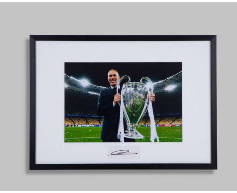 Zinedine Zidane signed photograph framed presentation, 15.5 by 10.5in. colour photograph of Zidane holding the UEFA Champions
