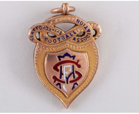 9ct gold and enamel Staffordshire Football Association medal, 1906-07, the obverse inscribed STAFFORDSHIRE FOOTBALL ASSOCIATI