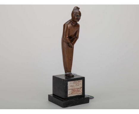 Pelé 1969 Jundiai Journal trophy, a trophy presented to Pelé composed of a bronze jester figure mounted on a black marble bas